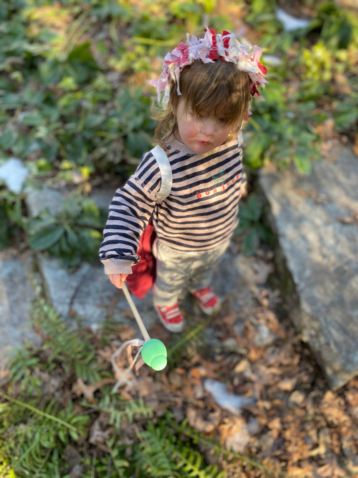 Girl wearing ladybug costume and aphid wand.