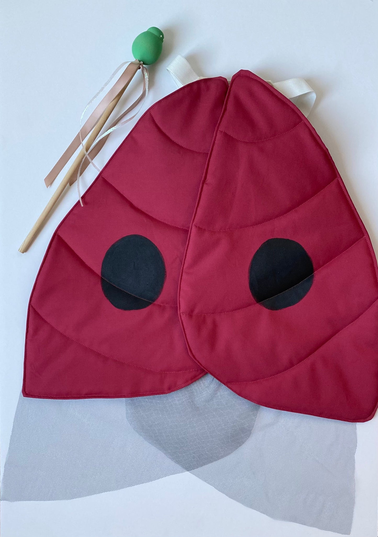 Ladybug costume with aphid wand for children.