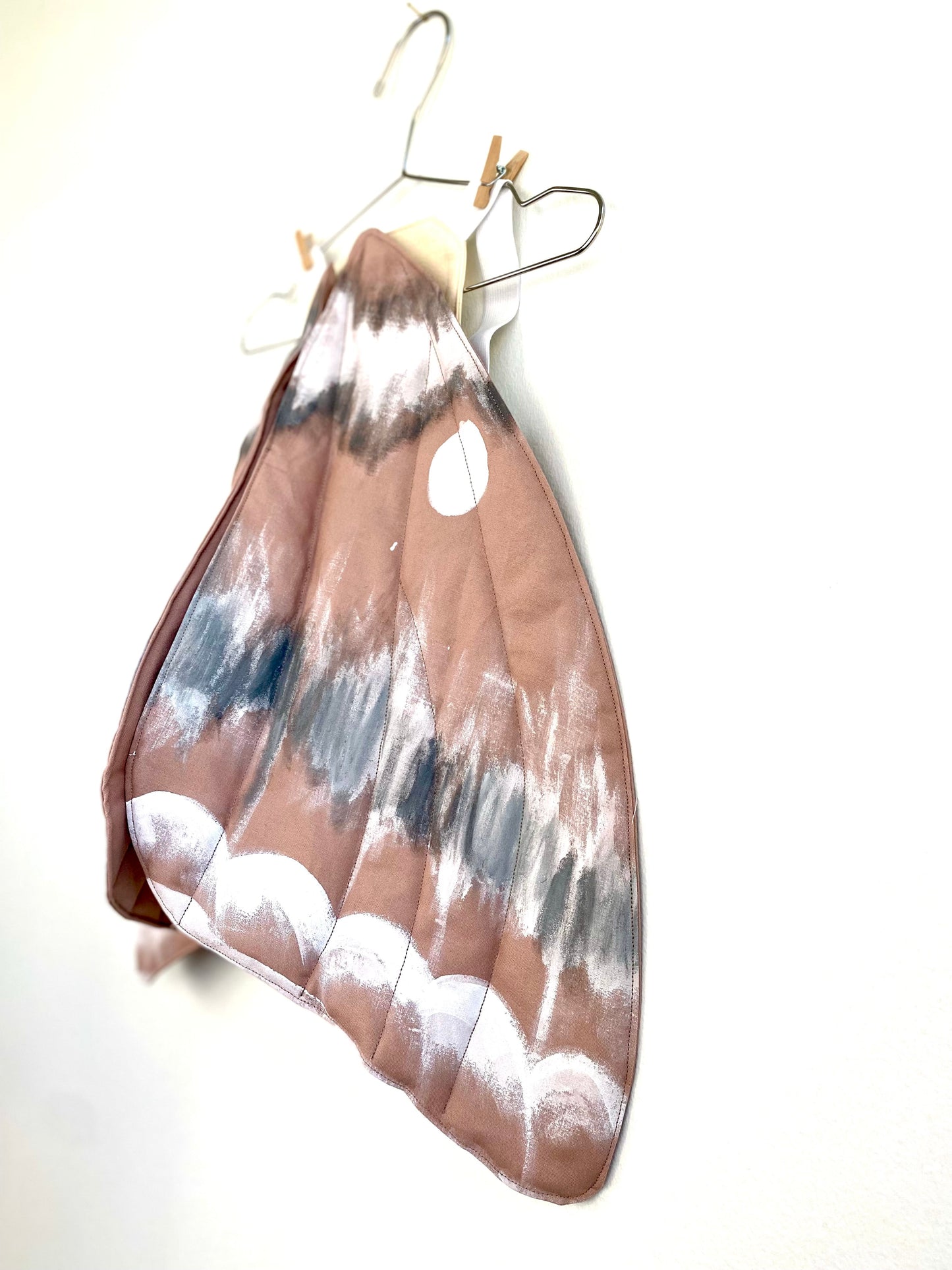 Moth wings costume for children's nature play.
