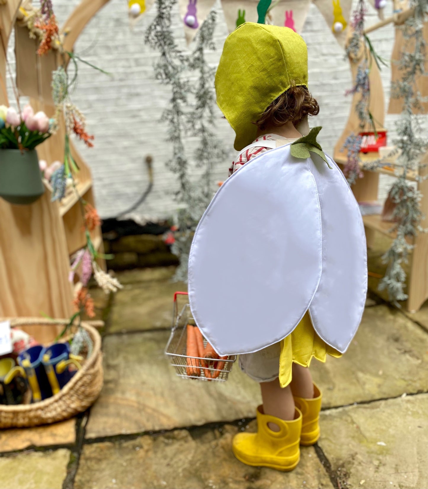 Farmer's market pretend play with flower costumes.