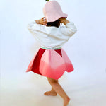 Twirly petal skirt with hat.