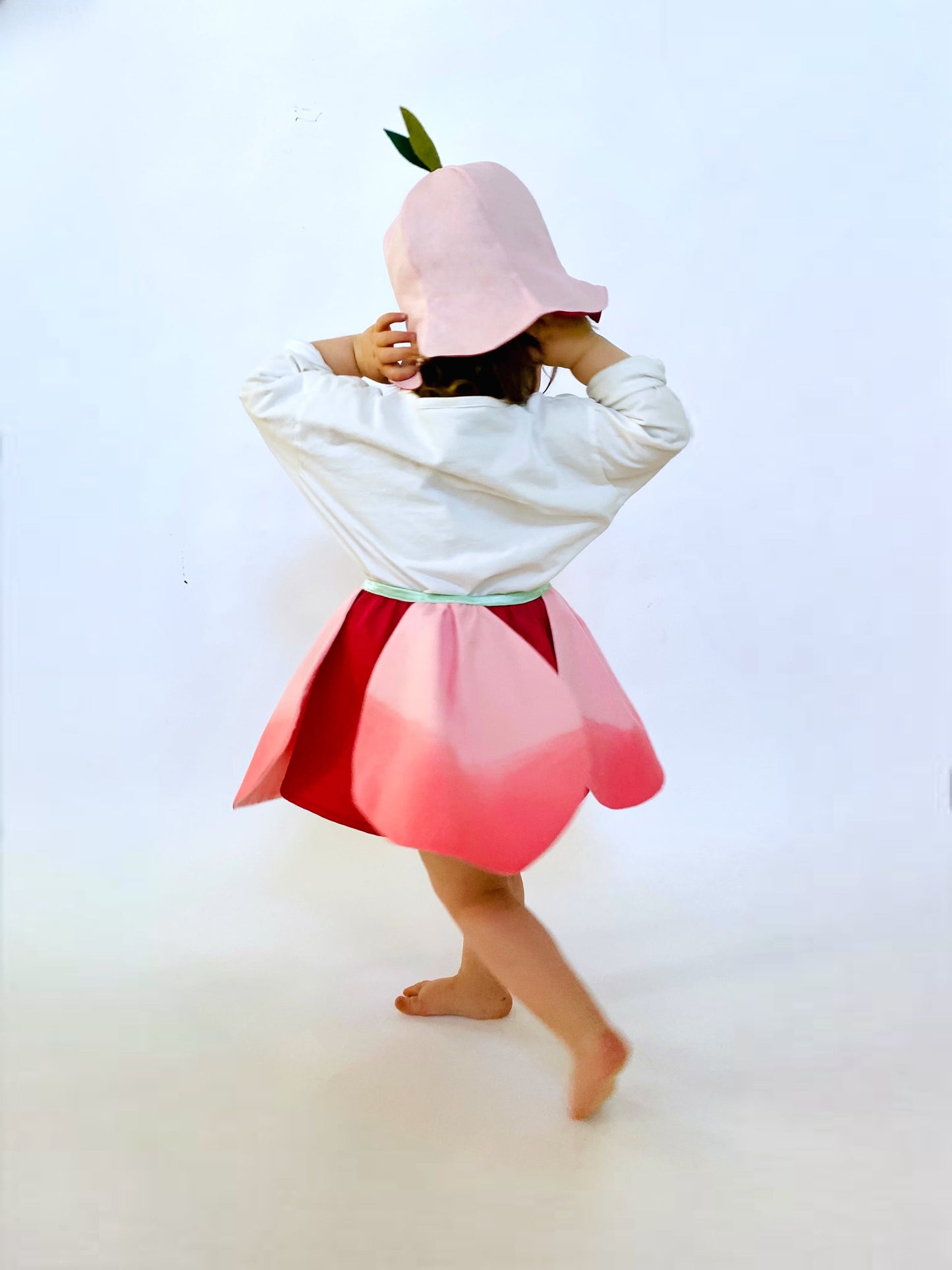 Twirly petal skirt with hat.